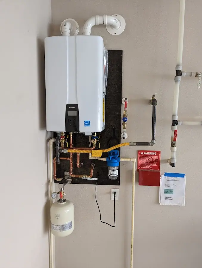 Professional plumber installing copper piping in a Savannah home